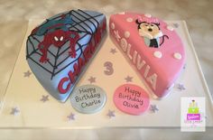 two decorated birthday cakes sitting on top of a cake plate with the name julia and spiderman