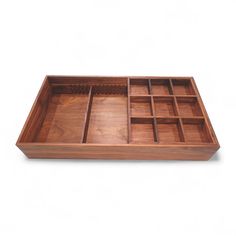 a wooden tray with compartments on it