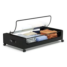 an open suitcase with clothes in it on top of a white surface and black wheels