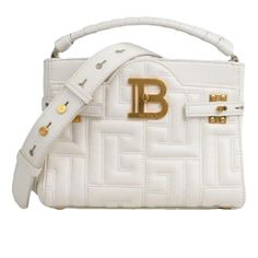 Color: White Golden Jewelry Dimensions: 22cm X 22cm X 8cm Beige Suede Lining Details Categories: Women Category: Bags - Sub-Category: Handbags Designer: Balmain Model: Bbuzz Condition: Good Condition - Material: Leather - Colour: White Luxury White Bag With Logo Hardware, Chic White Shoulder Bag With Logo Hardware, Elegant White Shoulder Bag With Logo Hardware, White Rectangular Shoulder Bag With Logo Hardware, White Top Handle Shoulder Bag With Logo Hardware, White Shoulder Bag With Logo Hardware, White Logo Shoulder Bag For Formal Occasions, Formal White Shoulder Bag With Logo, Luxury White Shoulder Bag With Embossed Logo