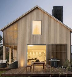 a large wooden house with an open deck