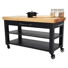 a black kitchen island with butcher block top