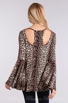 Solo La Fe Extra wide bell sleeves top, cut out neckline front and back. Soft jersey fabric. Extra long sleeves.Color: Animal Print Sizes S-M-L Bust 34-36-38, Length 26, our model is 5' 3" and wearing small 95% Rayon, 5% Spandex, Jersey, Made in USA B4/TD3280A Long Sleeve Stretch Tops For Brunch, Stretch Long Sleeve Blouse For Brunch, Stretch Long Sleeve Tops For Brunch, Fall Stretch Tops With Bell Sleeves, Fall Leopard Print Stretch Blouse, Fall Stretch Leopard Print Blouse, Stretch Leopard Print Blouse For Fall, Chic Bell Sleeve Long Sleeve Top For Fall, Stretch Bell Sleeve Tops For Fall