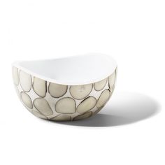 a white bowl with pebbles in it