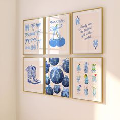 four blue and white pictures hanging on the wall