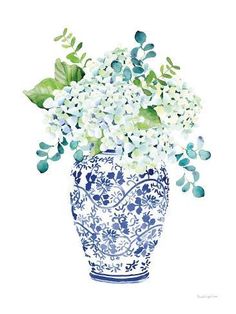 a blue and white vase with flowers in it