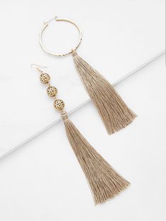 Details: Mismatched earring pair Gold toned metal Eardrop Height: 6-7" Metal Tassel Drop Earrings For Pierced Ears, Drop Earrings Outfit, Tassel Drop Earrings, Mismatched Earrings, Long Drop Earrings, Earrings Long, Earring Jewelry, Online Earrings, Trendy Tshirts