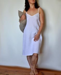 Linen summer nightgown.Lovely and simple night dress for women with frill.Very comfortable and soft. Linen fabric ensures comfort: cold for hot summer nights and warmth for cold winters.Fabric: 100% linen (medium weight linen).Color in the picture: whiteProduce time is about 1-5 days.The model is 168 cm /5ft5" high (size S) and the model is wearing the top in size S.Length approx. 37.4" (95cm)SIZING:XS (US 2, UK 6)Bust: fits bust around 84 cm / 33"Waist: fits waist around 66 cm / 26"Hips: fits h Casual White V-neck Nightgown, Spring V-neck Dress For Relaxation, Summer Nightgown For Relaxation, White V-neck Night Dress, Elegant Summer Nightgown For Bedtime, White Slip Dress For Spring Loungewear, White V-neck Slip Dress For Bedtime, Elegant Spring Dresses For Relaxation, Elegant Summer Dresses For Relaxation