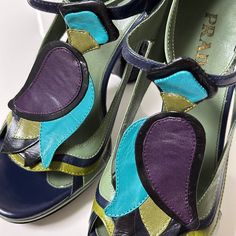 condition 9/10 color blue × purple × green size 36.5 (us 6.5, uk 3.5) insole 24cm, width 8cm, heel height 10cm, platform height 2cm the sole of the right heel is slightly chipped. made in italy free shipping worldwide (takes around 5days) Green Ankle Strap Sandals With Removable Insole, Luxury Multicolor Sandals For Spring, Green Open Toe Sandals With Sculpted Heel, Spring Green Heels With Leather Sole, Green Heels With Leather Sole And Round Toe, Designer Purple Sandals For Summer, Green Leather Sole High Heels, Luxury Green Platform Heels, Green Leather Sole Open Toe Sandals