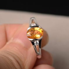 This is a gorgeous handmade creation. Its beauty is its simplicity & Elegance. The 6*8mm oval shape faceted natural citrine is crafted in solid sterling silver and with rhodium plated. All item is sent in a beautiful gift box If you have any idea of design your ring,pls contact me directly. You can realize more lovely stuff clicking the link https://www.etsy.com/shop/knightjewelry?refshopsection_shophome_leftnav Please leave the correct address and you phone number for delivering successfull Oval Citrine Birthstone Ring, Oval Yellow Citrine Birthstone Ring, Orange Oval Sapphire Gemstone Ring, Orange Oval Sapphire Ring, Oval Citrine Birthstone Ring For Anniversary, Oval Citrine Topaz Ring In White Gold, Oval Faceted Topaz Ring In Sterling Silver, Faceted Oval Topaz Ring In Sterling Silver, Oval Citrine Crystal Ring With Birthstone