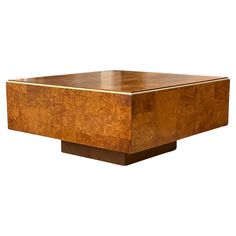 a square wooden table with an interesting design