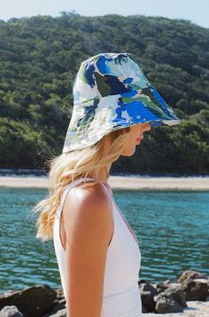 Handmade in limited quantities from our signature reclaimed linen, this Bucket Hat in the Monet Print features a flexible brim and snug fit that will keep you sun-safe all year round.  Designed and handmade in Brisbane, Australia. Pairs beautifully with the Monet Bikini, Dahlia Skirt or Andi Set. Blue Wide Brim Bucket Hat For Beach, Blue Flat Brim Hat For Beach Season, Blue Summer Bucket Hat For Travel, Blue Bucket Hat For Outdoor Beach Season, Blue Bucket Hat For Summer Travel, Blue Wide Brim Beachy Hat, Coastal Blue Hat For Vacation, Blue Flat Brim Sun Hat For Vacation, Summer Travel Bucket Hat In Blue