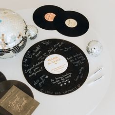 a table topped with disco balls, record players and other personalized items on top of it