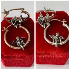 "Stylish adorable and very detailed Cherub/Angel Hoops ~ These cute cherubs we have one sitting while the other one is lounging ! The hoops are shiny 10k yellow gold, the cherubs are sterling silver. My hoops are solid gold NOT hollow Patented Design ERA- 2022 METAL / MATERIAL - 10k yellow gold/ Sterling Silver MARKINGS / HISTORY - Earrings are marked \"10k\" CONDITION - New Weight (both earrings): 4.42 grams" Silver Hoop Jewelry For Valentine's Day, Vintage Sterling Silver Hoop Earrings For Gift, Vintage Sterling Silver Hoop Earrings As Gift, Hallmarked Round Hoop Earrings As Gift, Gift Hallmarked Huggie Hoop Earrings, Sterling Silver Hoop Earrings For Valentine's Day, Handmade Silver Hoop Earrings For Valentine's Day, Small Hoop Earrings With Charms For Gift, Vintage Small Hoop Jewelry Gift