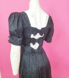 1980s Laura Ashley black cotton dress fitted bodice fab sleeves slight pattern to fabric flared skirt and romantic bows to the back so stunning perfect party or everyday dress Side zip fastening £65.99 ( plus p and p UK ) Bust 32 inches Waist 26 inches  Hips free Shoulder to waist 15 inches  Waist to hem 27.5 inches Condition  Minor wear Summer Evening Dress With Bow Print, Summer Evening Dresses With Bow Print, Party Dress With Bow Print And Short Sleeves, Short Sleeve Party Dress With Bow Print, Fitted Bow Print Evening Dress, Fitted Evening Dress With Bow Print, Elegant Fitted Dress With Bow Print, Black Party Dress With Bow Print, Elegant Black Dress With Bow Print