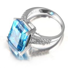 Color: Sea Blue Formal Blue Topaz Crystal Ring In Fine Jewelry Style, Blue Diamond Ring With Gemstone Accents For Promise, Blue Aquamarine Jewelry With Center Stone, Blue Aquamarine Fine Jewelry, Blue Topaz Jewelry For Formal Occasions, Light Blue Topaz Ring With Diamond Accents As Gift, Blue Cubic Zirconia Ring With Gemstone Accents, Blue Aquamarine Birthstone Ring, Blue Topaz Ring With Cubic Zirconia Gemstone Accents