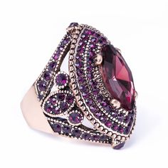 PRICES MAY VARY. Unique big size Turkish women ring. The length of this ring is 32mm(1.26inch), please pay attention on the size before purchase Antique gold plated alloy Embedded many purple crystals and resin Elegant statement rings for women and girls, available size: 6, 7, 8, 9,10 Ideal gift choice for Christmas, Valentine’s Day, Mother’s Day, Birthday Turkish Rings, Antique Style Rings, Turkish Style, Steel Flowers, Turkish Women, Fire Opal Ring, Evil Eye Ring, Sparkling Rings, Turkish Fashion