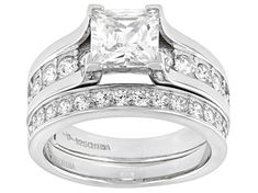 Bella Luce ® white diamond simulant 4.34ctw square and round, platinum over sterling silver ring with band. Measures approximately 0.88"L x 0.38"W and is not sizeable. The diamond equivalent weight is 2.93ctw. Dazzling White Square Cut Diamond Ring, White Square Cut Fine Jewelry For Wedding, White Princess Cut Diamond Ring In Sterling Silver, White Cubic Zirconia Diamond Ring Channel Set, Silver Asscher Cut Ring With Channel Set, White Rings With Center Stone Square Cut, White Cubic Zirconia Bridal Set Princess Cut, White Cubic Zirconia Princess Cut Rings, White Princess Cut Rings With Channel Set