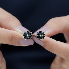 Product Details Add a pinch of spark to your outfit with these Stud Earrings, adorned with Marquise Shape Black Onyx Gemstone set in a floral pattern in Claw Setting. These lovely Floral Earrings are crafted in Solid Gold Metal Product Information SKU SHP-EARRINGS112112902 Length 9.5 mm Width 10 mm Weight 1.52 gm (Approximate) BLACK ONYX INFORMATION No.of Stones 24 Pieces Total Weight 3.10 Carat (Approximate) Dimension(approx) Marquise-2X4 mm-24 Pcs Color Black Cut Brilliant Shape Marquise Setti Black Stone Earrings, Statement Stud Earrings, Black Stud Earrings, Insta Profile, Black Stud, Claw Setting, Onyx Earrings, Onyx Gemstone, Ear Rings