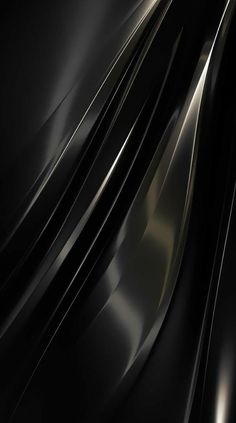 an abstract black and silver background with curved lines on the bottom right hand corner,