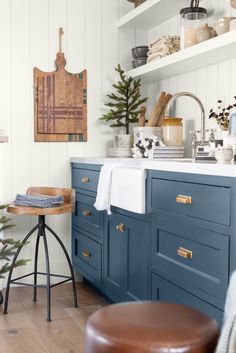 a kitchen with blue cabinets and white walls