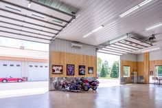 a garage with several motorcycles parked in it