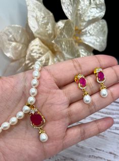 Beautiful Original Fresh PearlNecklace Ruby Emerald Green Stone AD Set,Fresh Water Pearls Necklace,Hyderabadi pearls Mala necklace set.Mother's Day Gift. 💕 Comes with the necklace and earring💕 High End Quality 100% Satisfaction Guarantee: Long Lasting Plating, High-Quality Stones. Colors Available- - Ruby -Emerald Green DISPLAY BOX IS AN ADDITIONAL $5. Perfect for any occassion-Shagun, Jago, sangeet, engagement, pre-wedding and parties.   Care: It is advisable that you keep our products away f Pearls Mala, Fresh Water Pearls Necklace, Pearl Mala, Emerald Green Stone, Pearls Necklace, Ruby Emerald, Fresh Water Pearls, Mala Necklace, Pearl Set