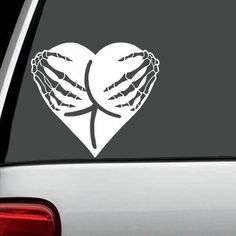 a heart shaped sticker on the back of a car