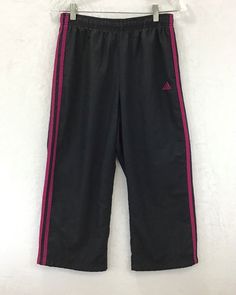 Thank-You SO MUCH For Supporting Small Business =) Adidas / Athleisure Crop Capri Athletic Pants Elastic Waist / Mesh Lined Fabric: 100% Polyester Waist is About 27" / Rise is About 10" / Inseam is About 21" Color: Black / Fuchsia Women's Size: S / Because Sizing Varies, and Often Washing Clothing May Change the Sizing, Please Compare the Actual Measurements Above to Those of Your Current Favorite Crop Athletic Pants, to Ensure a Great Fit Item #: D26-4 Top USA Seller / FAST SHIPPING! / I Absolu Adidas Cotton Gym Pants, Adidas Cotton Sweatpants For Gym, Adidas Cotton Gym Bottoms, Adidas Casual Workout Pants, Casual Adidas Workout Pants, Casual Capri Length Gym Pants, Adidas Stretch Sweatpants For Workout, Sports Capri Pants With Elastic Waistband, Sporty Capri Length Pants For Sports