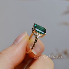 Solid 14K gold Emerald Ring, this beautiful emerald ring use a 7*9 mm(2-2.5ct) lab created emerald in the middle, with 3 round white stone on each side, elegant and simple style, suit for all different occasion, it's a great gift for someone you loved or yourself, we also will provide a beautiful ring box. ❥Details: Material: Solid 14K Gold, 3 color for choice, 14KW(white gold), 14KY(yellow gold), 14KR(rose gold) Main Stone: Real Lab Created Emerald Dimension: 7*9 mm Side Stone: CZ or Moissanite Square Emerald Engagement Ring, Green 14k Gold Ring For Proposal, Emerald Ring For Proposal In Fine Jewelry Style, 14k Gold Emerald Cut Emerald Ring For Proposal, Fine Emerald Ring For Proposal, Green Solitaire Emerald Ring For Proposal, Emerald Ring For Proposal, Emerald Cut Emerald Proposal Ring, Oval Green Emerald Ring For Proposal