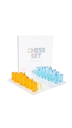 the chess set is in its plastic case and contains eight pieces, including one with blue glasses