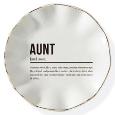 an empty round plate with the word'annt'written in black on it