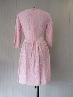 "Stunning 50s pale pink lace dress. Maybe custom-made for a special situation. Scoop collar and sleeves under elbow long (pic.2)It features one cute lace bow on waistline (pic.2). Two wide front pleats skirt in order to enlarge it. The top has a sort of capulet in front. Back long zipper. Lined. Very good conditions. It fits size S about 6-8 US Size 38-40 EU Measurements: (lay flat and double chest) Shoulders 16.5\" chest 37.7\" sleeve length 8.6\" total back length 22.4\" Bellissimo vestito ann Pink Lace Dress For Formal Occasions, Feminine Pink Lace Dress For Formal Occasions, Pink Long Sleeve Lace Dress For Wedding, Formal Pink Long Sleeve Lace Dress, Pink Lace Dress With Lace Patchwork For Formal Occasion, Fitted Lace Dress With 3/4 Sleeves For Weddings, Fitted 3/4 Sleeve Lace Dress For Wedding, Fitted Pink Lace Dress With Lace Sleeves, Fitted Lace Dress For Wedding With 3/4 Sleeves