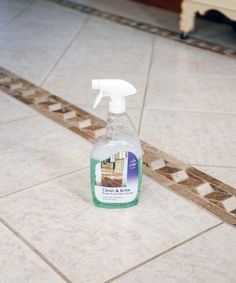 a bottle of cleaner sitting on the floor