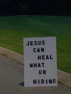 a sign that says jesus can heal what our hiding is on the side of the road