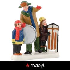 a figurine is shown with two children and a man holding a frisbee