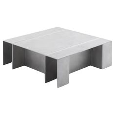 a white coffee table sitting on top of a white floor