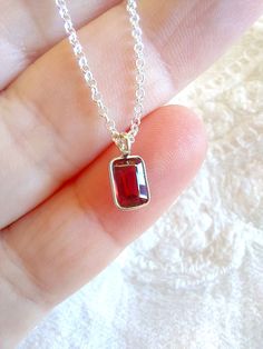 "Sterling Silver Dainty garnet Necklace, birthstone necklace. Size shown is 16\". Please choose your favorite necklace length at checkout. All lengths have a one inch extender, that way you'll have some wiggle room to play with the length. For example, if you choose a 14 inches necklace length, you'll have options to close the necklace at any length between 14 inches and 15 inches.  Some of this charms are sold by themselves (no chain). If that option is available for this, you will have the option to buy \"CHARM ONLY\" before adding the item to the cart. Normally, a 3 mm ring made out of the same material is attached to the charm. If you own a chain and plan to use the charm for it, ensure that the 3 mm ring will pass through, or you have a bigger ring if needed, and/or you know how to op Red Sterling Silver Jewelry For Mom, Red Sterling Silver Jewelry As Gift For Mom, Faceted Birthstone Necklace In Sterling Silver As Gift, Gift Faceted Birthstone Necklace In Sterling Silver, Red Ruby Birthstone Necklace Gift, Red Dainty Birthstone Necklace, Red Gemstone Birthstone Necklace In Sterling Silver, Faceted Garnet Necklaces For Gifts, Ruby Gemstone Birthstone Necklace Gift