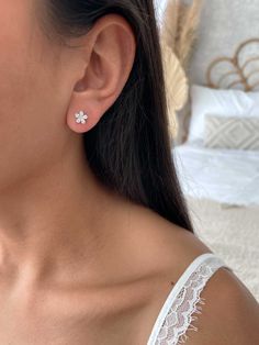 Elevate your elegance with our exquisite flower stud earrings, meticulously crafted from premium 925 sterling silver. These delicate earrings feature intricate floral designs, each adorned with shimmering zirconia stones that add a touch of sparkle to your look. The luminous zirconia stones are beautifully set to enhance the intricate flower pattern, creating a stunning effect that's perfect for both everyday wear and special occasions. With their timeless charm and versatile style, these earrin Cute Flower Earrings, Silver Earring Studs, Elegant Flower-shaped Cubic Zirconia Diamond Earrings, White Flower-shaped Cubic Zirconia Diamond Earrings, Fine Jewelry White Diamond Flower Earrings, Flower Shaped Cubic Zirconia Bridal Earrings As Gift, Cubic Zirconia Bridal Earrings In Flower Shape, Diamond White Cubic Zirconia Flower Earrings, Flower Shaped Cubic Zirconia Earrings In Diamond White