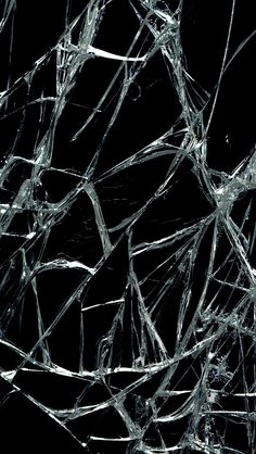 shattered glass on a black background with no image to describe, it looks like something that is