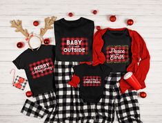 three matching family christmas outfits with reindeer antlers on the top and plaid pants,