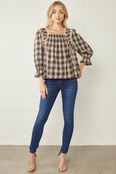 She's classy and flattering and embracing our favorite cottage core trend. The Elsie blouse has a square neck front and back, shirred elastic across the bust and back, exaggerated eyelet detail across the shoulder and the perfect plaid. Lined through the bodice and the perfect blouse for denim and skirts. Material75% Cotton25% PolyesterWoven Fabric Has No Stretch3/4 Length SleeveCased Elastic in Sleeve CuffEasy Fit Wash Cold, Hang to Dry MaterialMegan is wearing a size MModel is wearing a size S Cotton Smocked Puff Sleeve Top For Fall, Plaid Puff Sleeve Top For Fall, Fall Cotton Smocked Top With Puff Sleeves, Chic Plaid Top With Smocked Back, Fall Cotton Peasant Top With Smocked Bodice, Cotton Peasant Top With Smocked Bodice For Fall, Plaid Cotton Top With Smocked Bodice, Plaid Cotton Tops With Smocked Bodice, Fitted Cotton Smocked Top For Fall