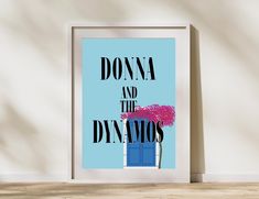 a blue poster with the words donna and the denmos on it in front of a white wall