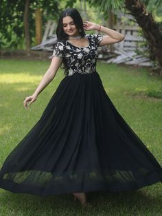 Introducing our stunning "black embroidered georgette reception wear gown" that is sure to make you stand out at any event or function. This black gown features exquisite sequin and embroidered work, adding a touch of elegance and glamour to your look. Crafted from high-quality georgette fabric, this gown is the perfect choice for those special occasions when you want to look and feel your best.
This black reception wear gown is that it comes fully stitched, saving you the hassle of alterations Evening Lehenga With Resham Embroidery In Maxi Length, Semi-stitched Embellished Black Anarkali Set, Party Evening Dress With Resham Embroidery, Floor-length Evening Dress With Resham Embroidery For Party, Black Georgette Party Dress, Festive Georgette Gown With Sequins, Semi-stitched Embroidered Party Dress, Floor-length Georgette Gown With Intricate Embroidery, Festive Sequined Georgette Gown