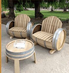 three wooden chairs sitting next to each other on top of a cement floor near trees