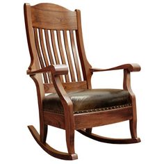 a wooden rocking chair with leather seat and armrests on an isolated white background