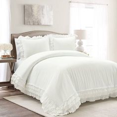 white bedding with ruffled edges in a bedroom