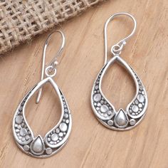 Using traditional Balinese designs artisan Yuniati creates a beautiful pair of dangle earrings perfect for a night on the town. Crafted from sterling silver in a combination finish the earrings feature an elegant drop-shape with a hollow center while intricate decorations give the earrings an alluring look. Mandela Designs, Mandela Design, Castle Window, Earrings Ideas, Silver Dangle Earrings, Sterling Silver Dangle Earrings, Ear Rings, Silver Earrings Dangle, Artisan Craft