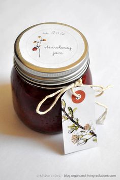 a jar filled with jam next to a tag