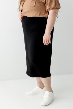 Everyday glam doesn't get easier than the pull on Sasha skirt! It's effortless and elegant - what skirt dreams are made of! Tailored in a modern midi length, this soft knit skirt is fitted with a hidden elastic waistband for a secure fit. From everyday wear to business casual to Sunday morning - this basic skirt is a must have for every modest wardrobe! Exclusively designed with you in mind. 95% Rayon 5% Spandex Hand Wash Cold Do Not Bleach Lay Flat or Hang to Dry Low Iron if Needed Lined Model Modest Stretch Skirt With Elastic Waistband, Stretch Midi Pencil Skirt In Solid Color, Solid Stretch Skirt For Daywear, Comfortable Versatile Midi Skirt, Versatile Midi Length Relaxed Skirt, Spring Stretch Midi Length Pencil Skirt, Midi-length Bottoms With Elastic Waistband And Stretch, Stretch Midi Bottoms With Elastic Waistband, Stretch Bottoms With Elastic Waistband And Midi Length